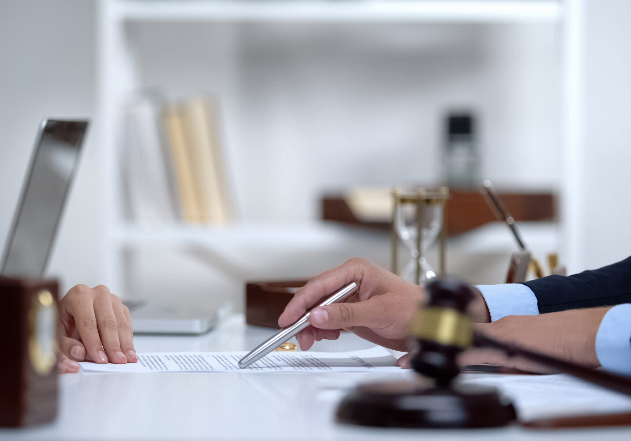 Attorney showing woman where to sign divorce document, legal consultation